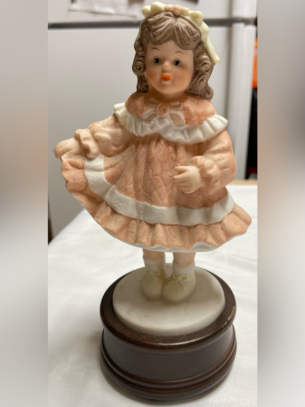 Porcelain Girl Figurine in Peach and White
